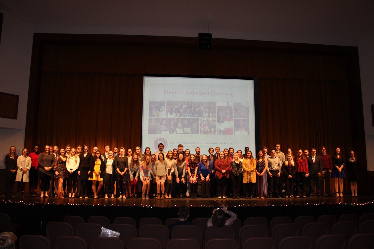 Adrian College Members on Stage Together.