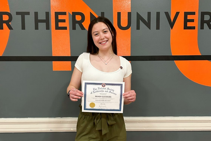 NSLS Member with their Induction Certificate.