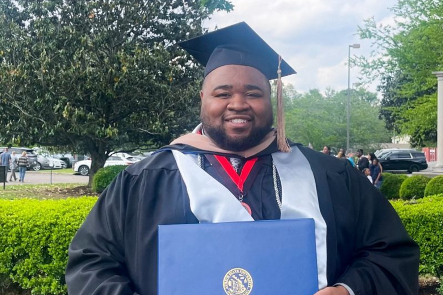 NSLS Member in Graduation Regalia.