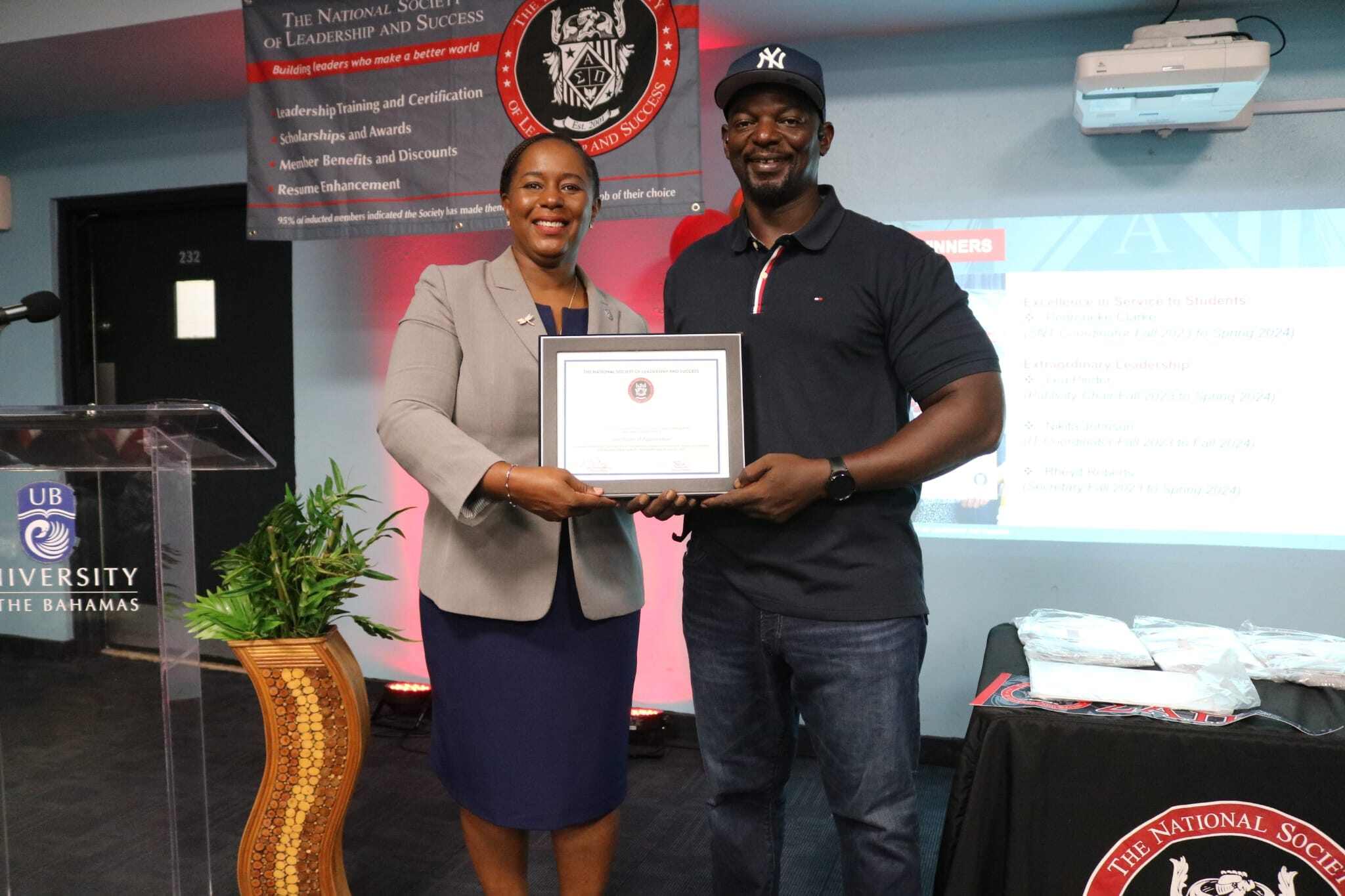 NSLS member receiving an induction certificate